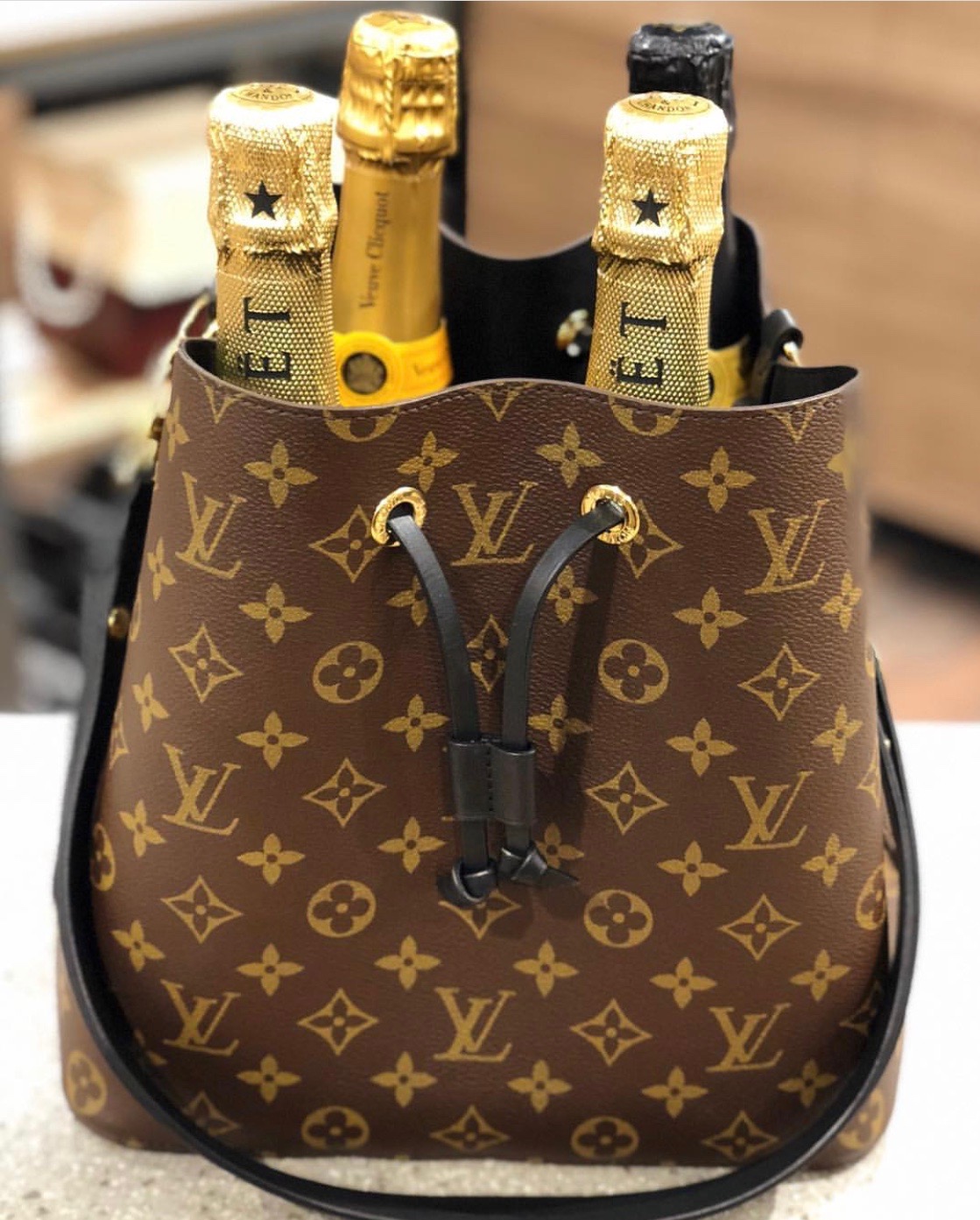 Louis Vuitton Noé: The Champagne Carrier Turned Coveted Handbag, Handbags  & Accessories